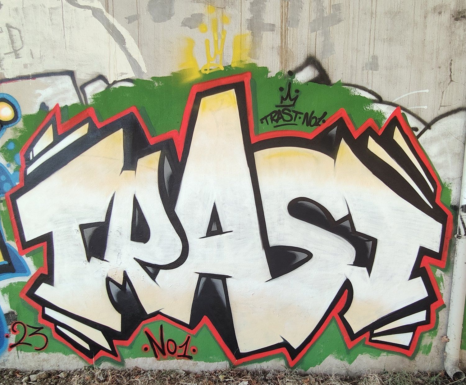 White, red and green TrAsT No1 lettering