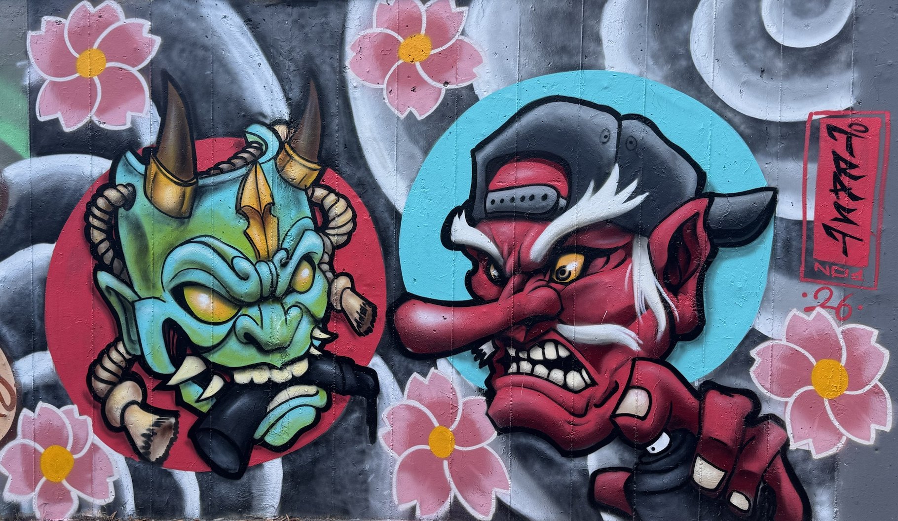 Hannya and Tengu masks painted by Federico Bavieri in the Ponte Alto underpass, Modena